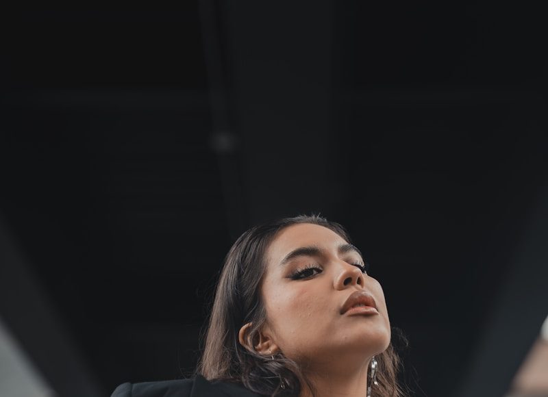 A woman in a white shirt and black blazer