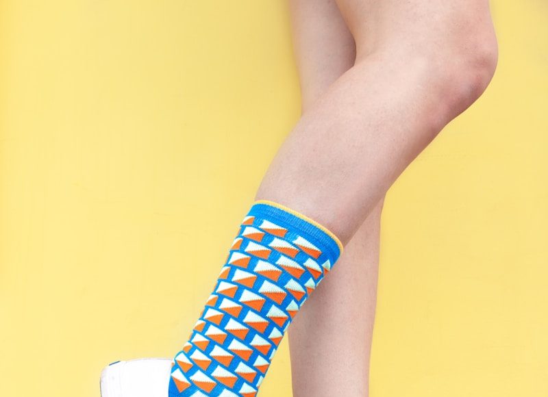 woman wearing sneaker and sandal