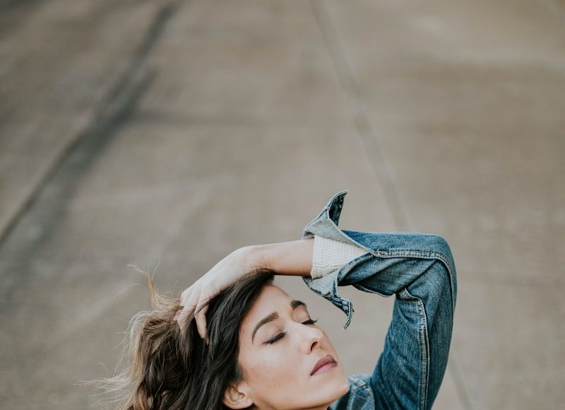 woman wearing blue denim jacket