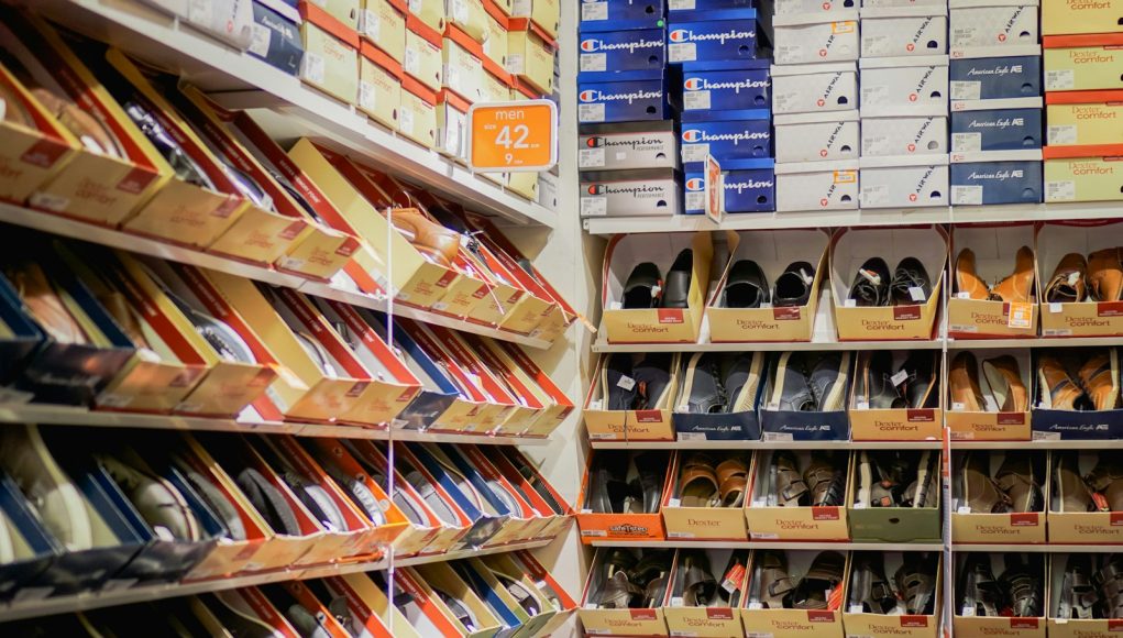 assorted pairs of shoes on boxes