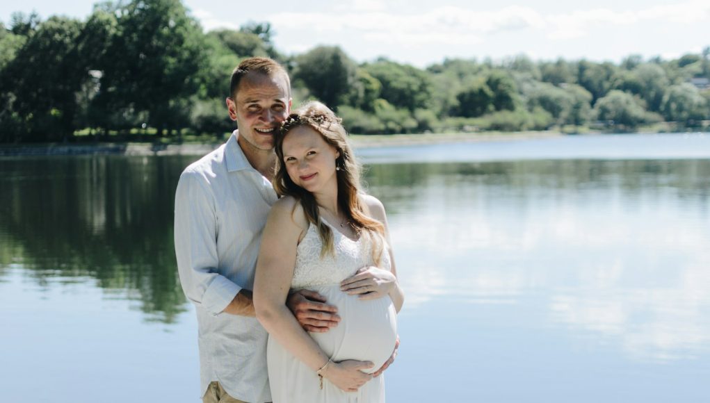 man holding woman tummy