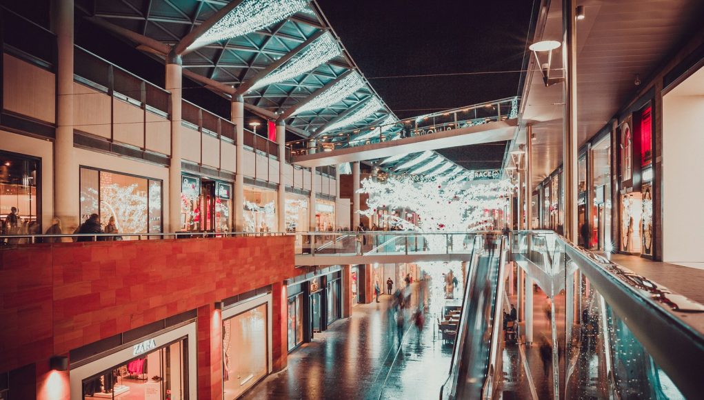people inside building with escalator